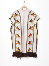 フリンジニットポンチョ